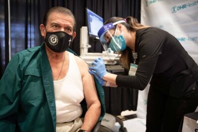 State Sen. Eddie Lucio Jr. receiving a vaccination at the Doctors Hospital at Renaissance’s conference center in Edinburg, Texas, on Saturday.